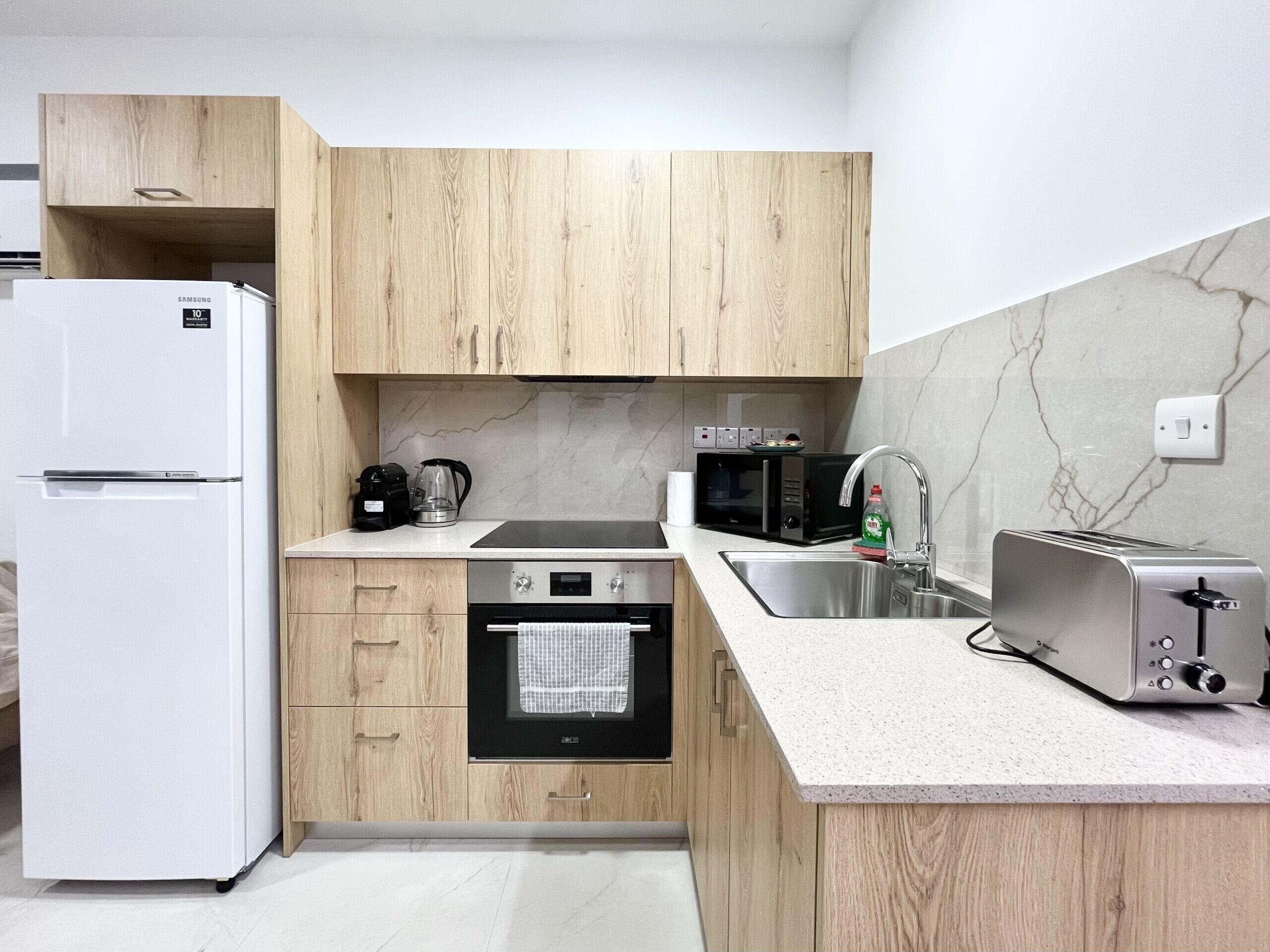 Coffee/tea maker, fridge, microwave, oven