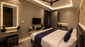 A modern bedroom with a bed, bedside tables, a TV, and a ceiling fan.