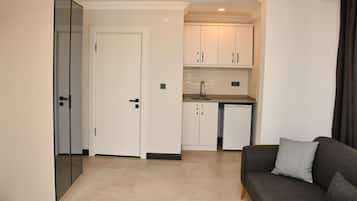 Deluxe Suite, Balcony | Living area