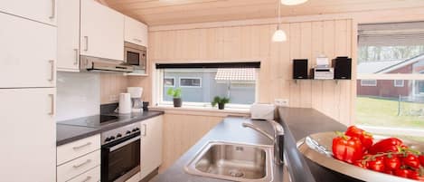 Coffee/tea maker, fridge, microwave, oven