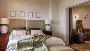 A hotel room with a large bed, two bedside tables, a chair, and a mirror. - Villa MAR DE LUR by Abahana Villas (Calpe / Calp)