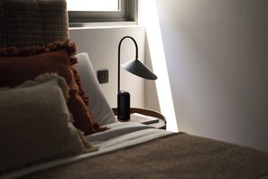 A bed with pillows, a bedside lamp, and a window. - Layan - 10 Min to Beach - Private Designer Villa (Thep Krasatti)