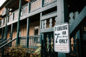 A sign indicating parking is reserved for Tuscany vehicles only. - Downtown Helen | Steps to Main Square (Helen)