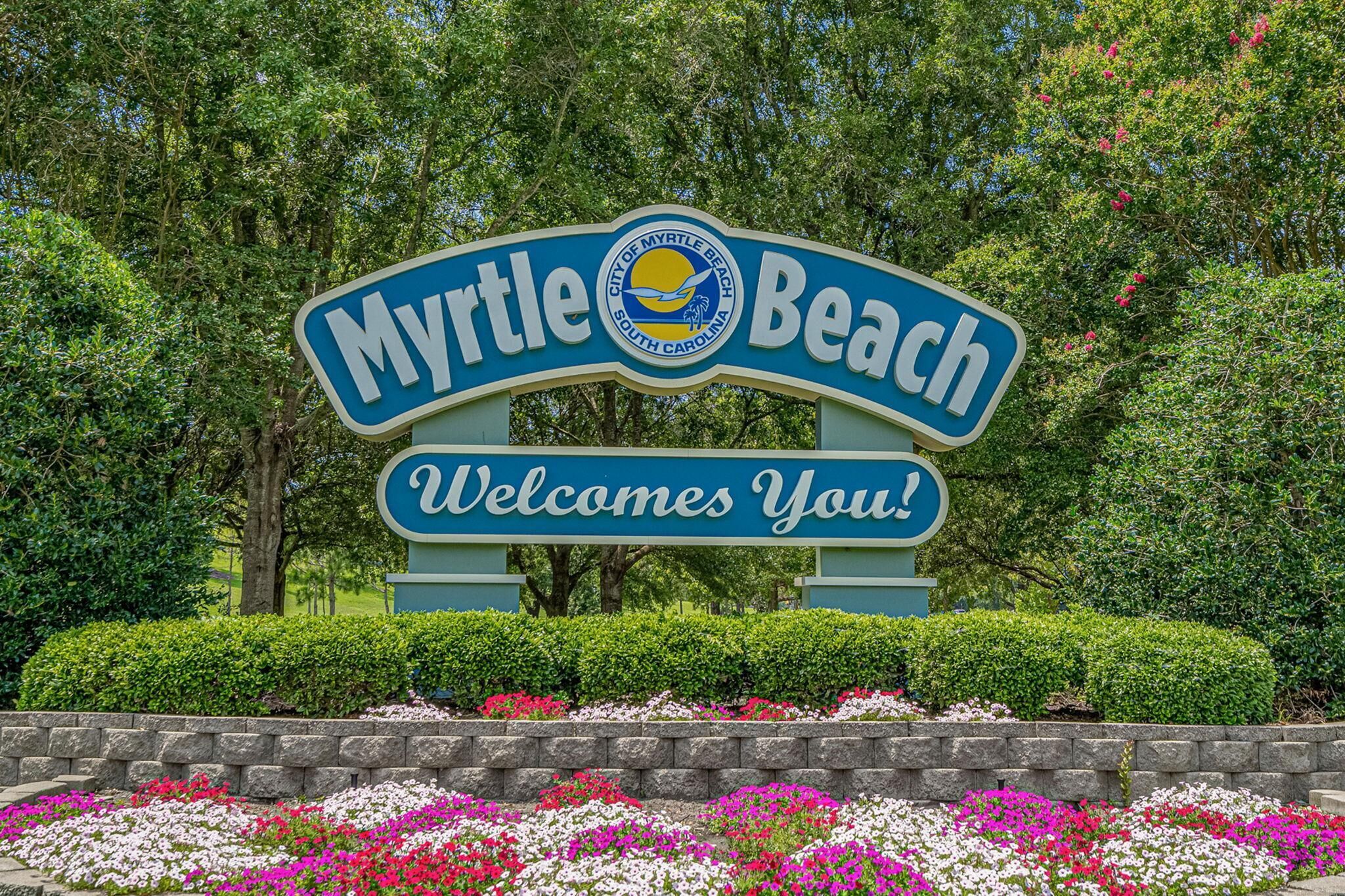 A sign for Myrtle Beach with a welcoming message.