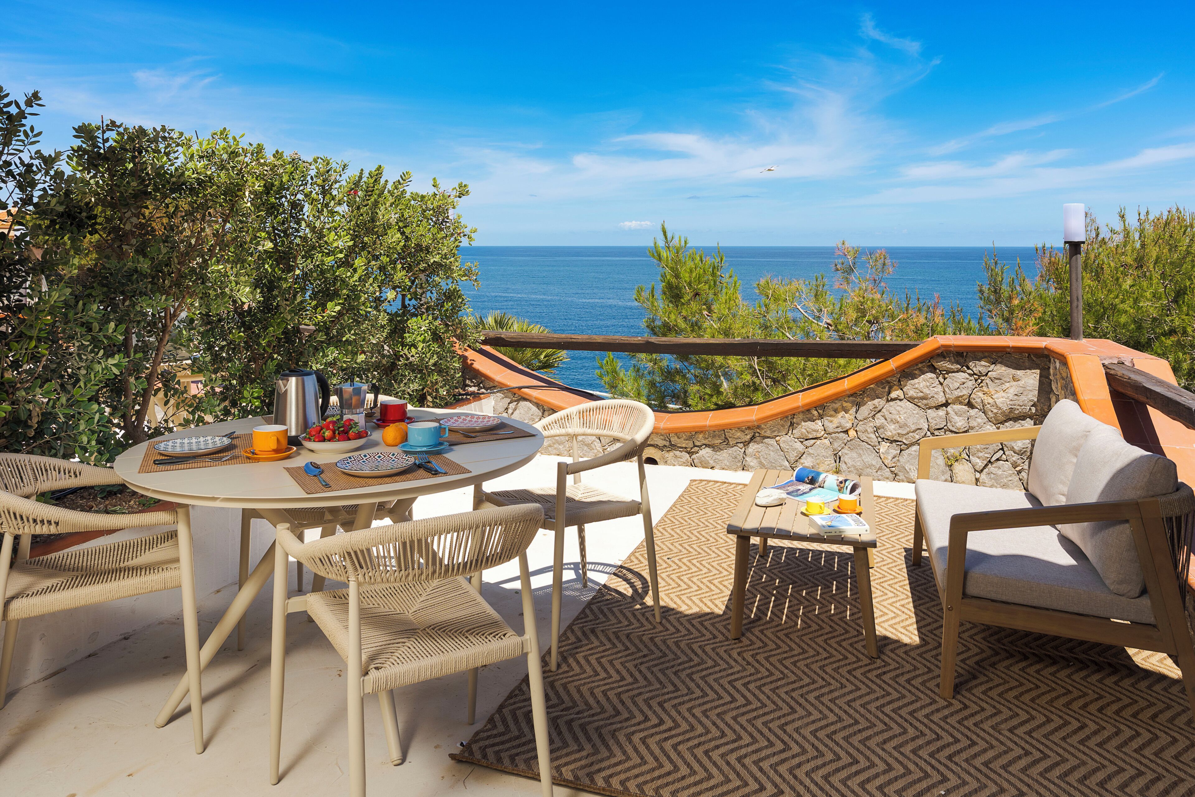 Deluxe Suite, 2 Bedrooms, Sea View | Outdoor dining