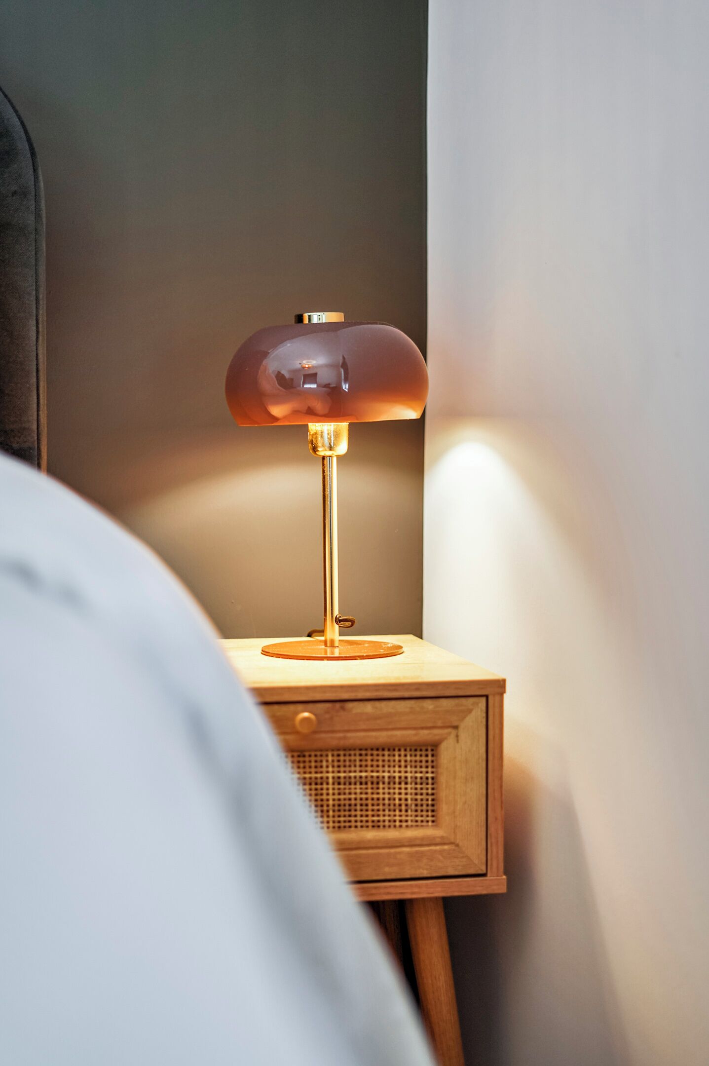 Warm bedside lighting creates a cozy ambiance, perfect for relaxing after exploring the village center.