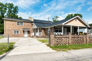 A two-story brick house with a front porch, a garage, and a driveway. - 9 Mi to Dtwn Charleston! Park Circle Extended Stay (North Charleston)