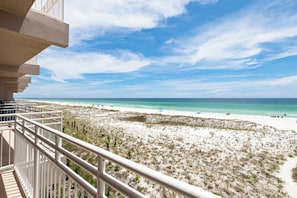 A balcony with a view of a beach and ocean. - Gulf Front Condo at Seahorse Condos | Dog Friendly | Sleeps 9 (Pensacola Beach)