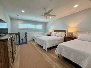 A bedroom with three beds, a ceiling fan, and a window with blinds. - Susie's LGI - Free Ferry + Golf Cart + Pool (Placida)