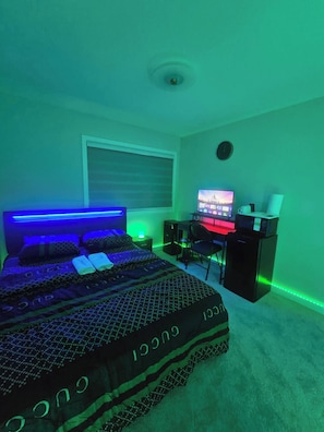 A bedroom with a bed, a desk, and a computer monitor. - SwitHome Properties Glen Near Yeg Airport | 5 beds 2.5 baths with Double Garage (Edmonton)