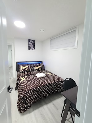 A bedroom with a bed, a desk, and a chair. - SwitHome Cher Private Suite+Studio (PondView) 2BR & 2Baths, Near YEG Airport (Edmonton)