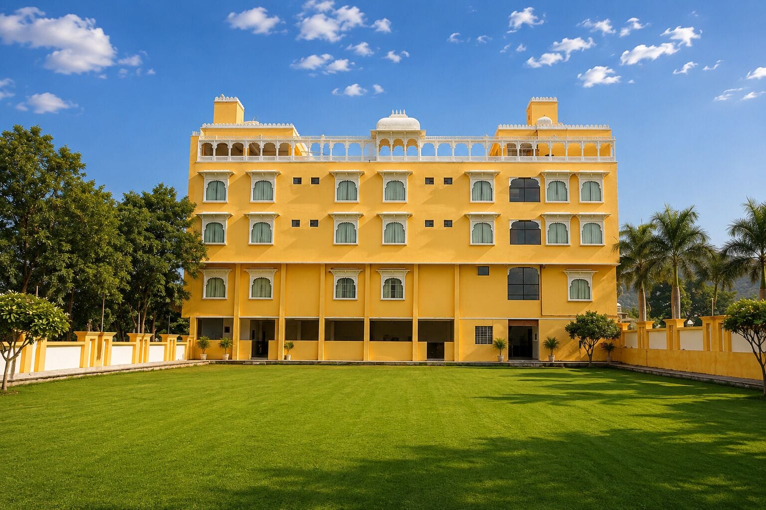 A multi-story building with a flat roof, large windows, and a symmetrical facade.