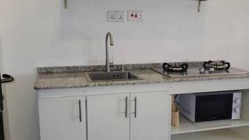 Appartement, salle de bains privée | Cuisine privée