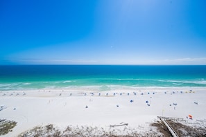 A beach with white sand and a clear blue sky. - Phoenix V 1511 1 Bedroom Condo (Orange Beach)