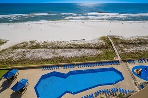 A beachside hotel with a swimming pool, beach access, and a view of the ocean. - Phoenix V 1111 1 Bedroom Condo (Orange Beach)