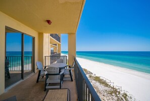 A balcony with a view of a beach and ocean. - Phoenix V 1214 1 Bedroom Condo (Orange Beach)