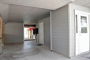 A hallway with a door on the right, a window on the left, and a staircase leading to another level. - 🌊Coastal Townhouse | Pool & Tennis Court | Walk2Beach | Barrier Dunes 542 - 55 (Cape San Blas)