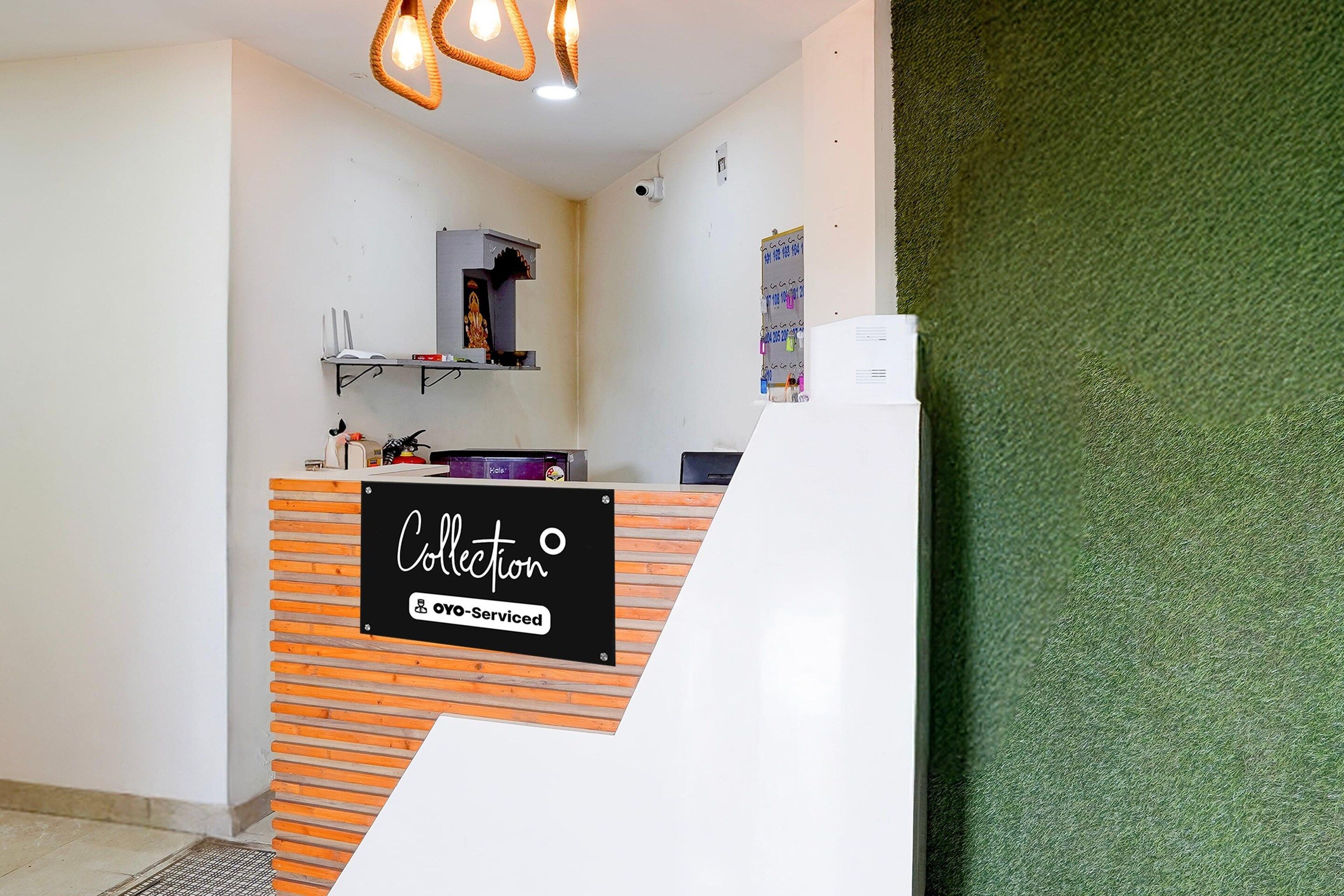 A reception desk with a sign indicating it's a self-service area.