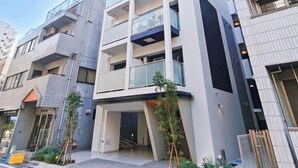 A multi-story building with balconies and a modern architectural design. - Triphome Sugamo Asahi 2026 New (Toshima City)