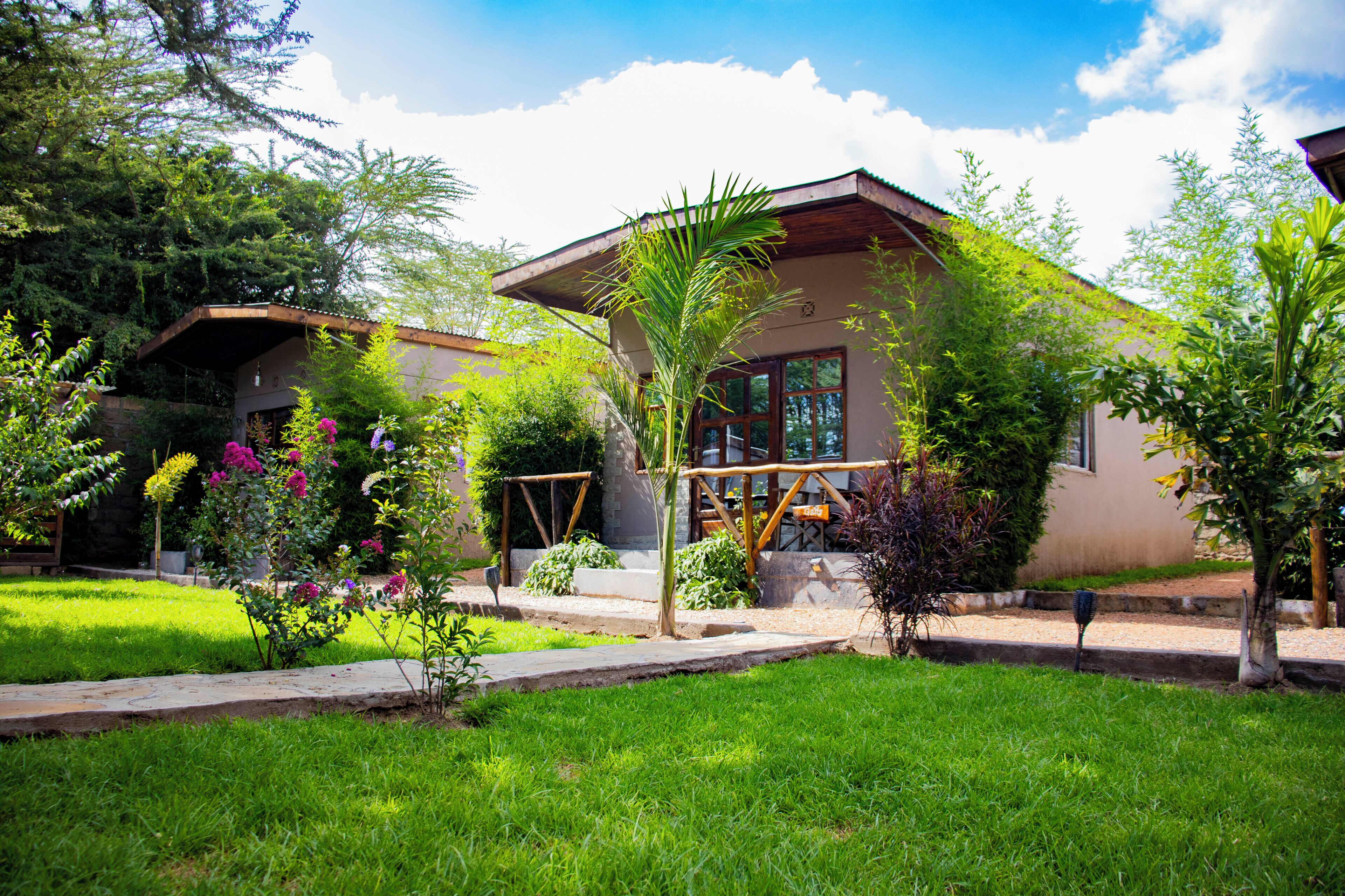 Deluxe Cottage, Patio, Pool View | Property grounds