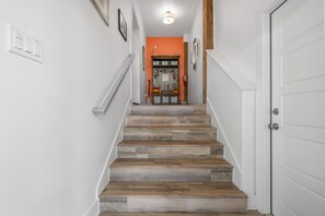 A staircase with wooden steps leading to a door. - Paradise Ahoy New Private Pool Decks With Views (Port Aransas)