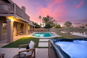 A residential property with a swimming pool, hot tub, and outdoor seating area. - Lakeside 5BR Retreat Pool Hot Tub (Glendale)
