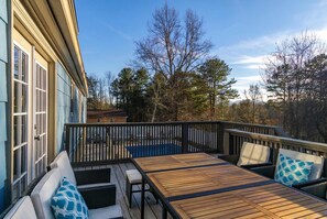 A wooden deck with outdoor furniture, a pool, and a view of trees and a building. - 15 Mins to DT Asheville Pool Hot Tub Game Room (Asheville)