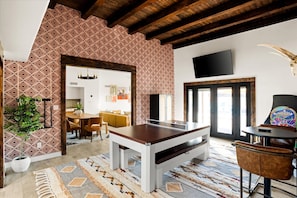 A room with a pool table, a dining area, and a large window. - Pickleball Paradise Sleeps 16 Pool Hot Tub (Glendale)