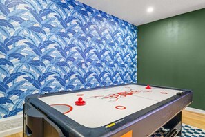 A room with a pool table, green walls, and a blue leaf-patterned wallpaper. - 1 Mile to Beach Pool Tiki Bar Mini Golf (Seminole)
