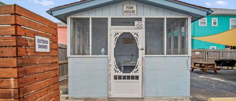 A small, single-story building labeled 'Fish House' with a sign indicating it is private property.