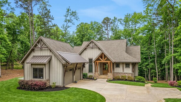 A two-story house with a covered front porch, a garage, and a well-maintained lawn. - Lakefront Getaway Dock Fire Pit Kayak Games (Seneca)