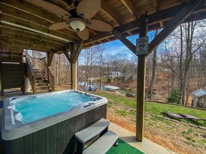 A hot tub under a wooden gazebo with a view of a lake and houses in the background. - Lakefront Villa Hot Tub Game Room Boat Lift (Mooresville)
