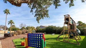 A playground with a climbing structure, a slide, and a ball pit. - Sleeps 24 Free Heated Pool Pickleball Theater (Scottsdale)