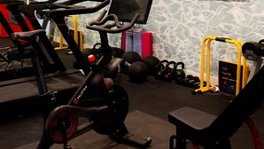 A gym with stationary bikes, treadmills, and weightlifting equipment. - Luxury Lakefront 5 Br Home Hot Tub Arcade (Truckee)