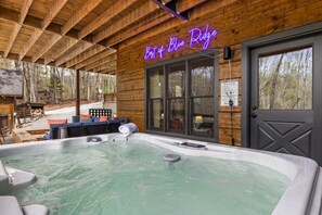 A wooden cabin with a hot tub and a neon sign reading 'Best of Blue Ridge.' - Best of Blue Ridge Hot Tub Games Pickleball (Cherry Log)