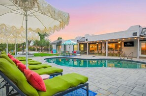 A pool area with lounge chairs, a bar, and a restaurant. - Scottsdale Retreat Pool Pickleball Spa (Scottsdale)