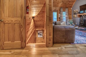 A wooden interior with a hallway leading to a bedroom. - Blue Ridge Treehouse Escape Views Hot Tub (Blue Ridge)