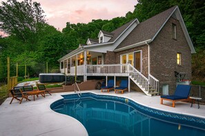 A house with a swimming pool, outdoor seating, and a deck. - Massive Asheville Compound A Memorable Experience (Weaverville)