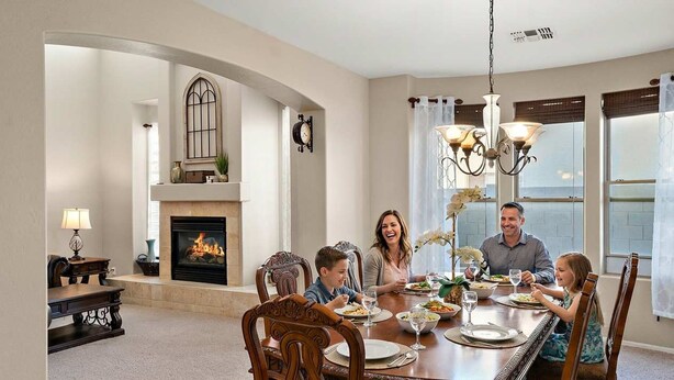 A dining room with a fireplace, chandelier, and a view of the outdoors. - Sleeps 14 Pool Spa Fire Pit Billiards EV Plug (Mesa)