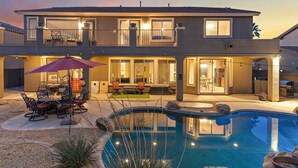 A two-story house with a swimming pool, outdoor seating, and a patio area. - Sleeps 14 Pool Spa Fire Pit Billiards EV Plug (Mesa)