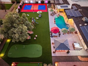 A rooftop with a basketball court, a swimming pool, and solar panels. - The Desert Reserve Pool Sport Court 7BR (Scottsdale)