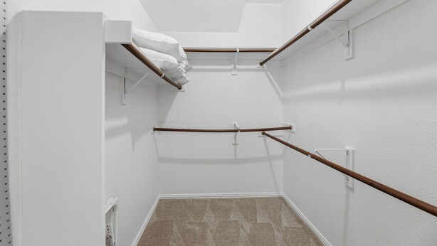 A narrow, white-walled hallway with a sloped ceiling and a wooden handrail on the right. - 4 Themed Rooms 11 Min to Universal Kids (Frisco)