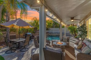 An outdoor patio with a covered seating area, a pool, and a fire pit. - Minutes to Wineries Outdoor Oasis Pool Table (Murrieta)