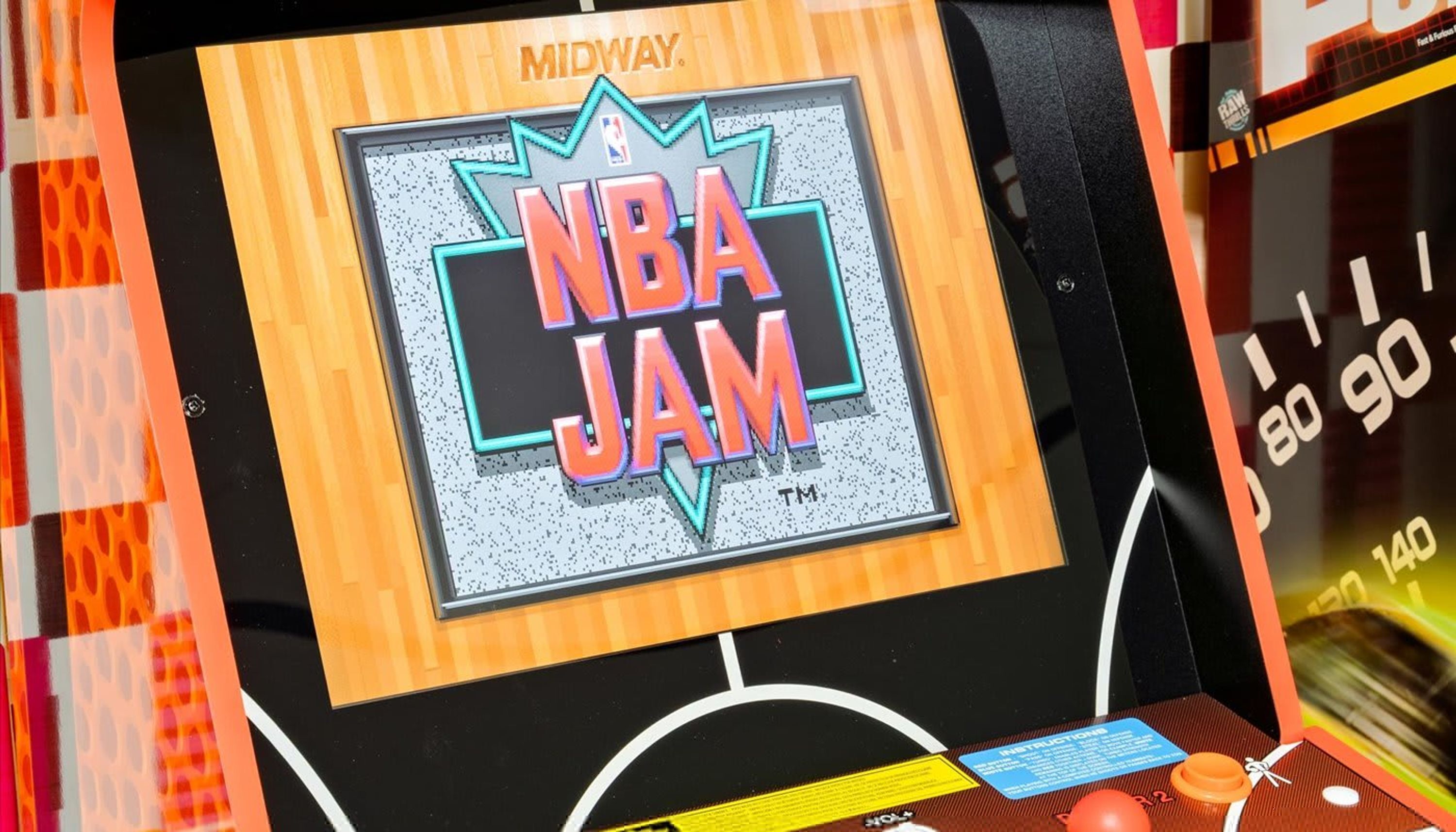 A basketball arcade game with the NBA JAM logo.