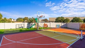 An outdoor basketball court with a green slide and a basketball hoop. - Sleeps 19 Pool Sport Court Putt Putt Gym (Mesa)