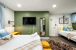 A hotel room with two beds, a television, a mirror, and a wardrobe. - Poconos Lodge - Hot Tub Sauna Game Room Fire Pit (Long Pond)