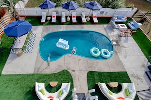 A swimming pool with lounge chairs and umbrellas. - Golf Sim Theater Games Walk to Beach Sleeps 28 (North Myrtle Beach)