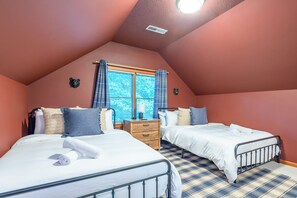 A bedroom with two beds, a window with curtains, a wooden dresser, and a ceiling light. - 6 Br Sleeps 20 I Sauna Theater Putt Putt Hot Tub (Asheville)