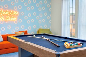A pool table with balls and cues, a neon sign, and a patterned wall. - The Painted Paddle Pool Hottub Pickleball Court (Lake Dallas)