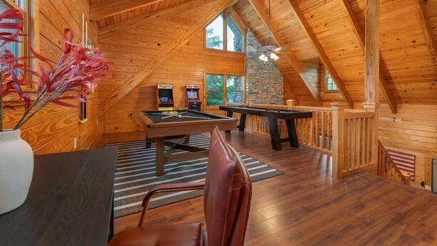 A wooden interior with a pool table, two arcade machines, and a billiards table. - 7 Br Sleeps 20 Sport Court Pool Hot Tub Playground (Arden)